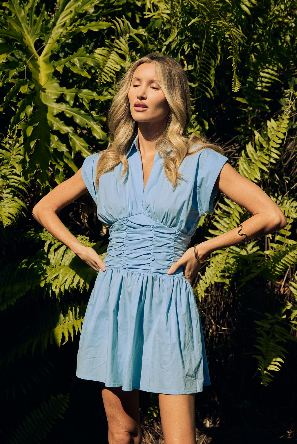 Lana Mini Dress sky blue — sky blue collared mini dress hands on hips garden shot — Little JC Boutique