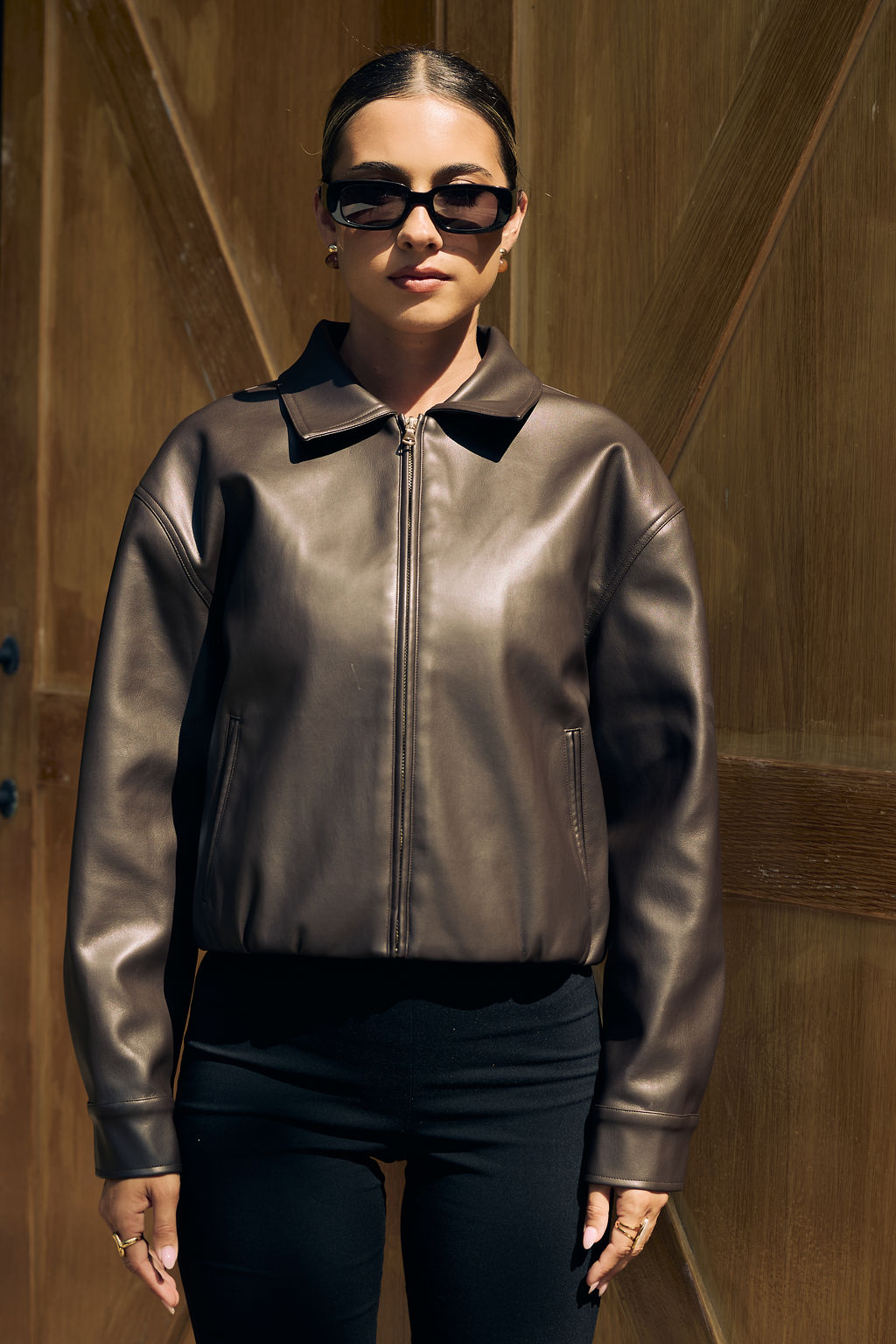 Chocolate brown oversized faux leather jacket front view — Little JC Boutique
