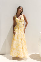 Penny Dress — yellow floral maxi dress back view with strappy detail — Little JC Boutique