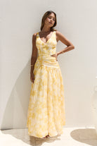 Penny Dress — yellow floral maxi dress back view with cut out detail — Little JC Boutique