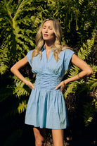 Lana Mini Dress sky blue — sky blue collared mini dress hands on hips garden shot — Little JC Boutique